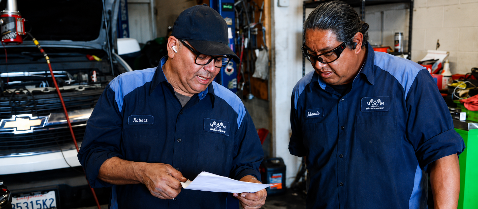 Robert and Jalanito reviewing engine work at MJM Engines